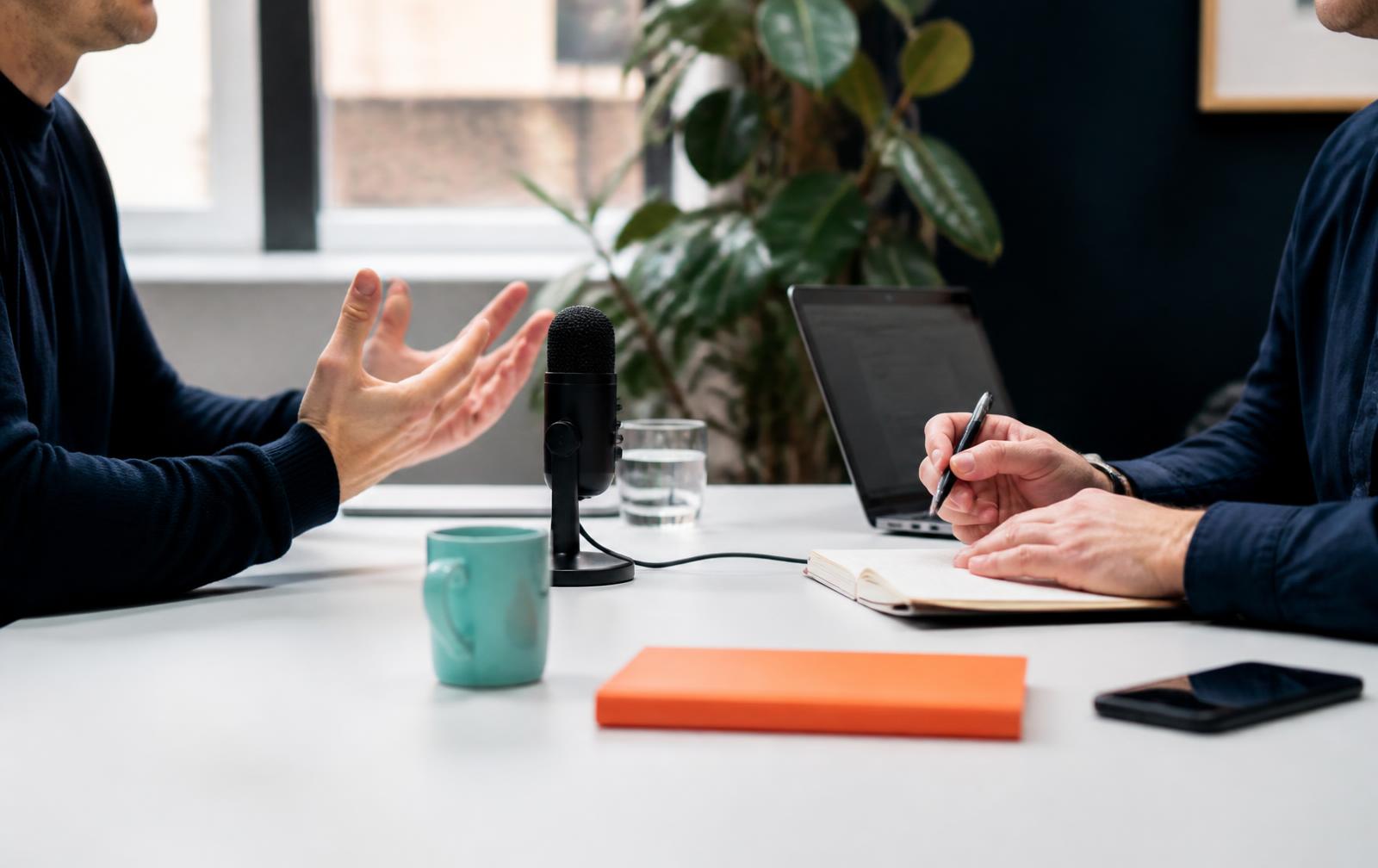 An expert conversation being recorded at a studio table